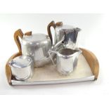 A Picquot ware cast aluminium four piece tea set and tray. (5)