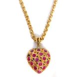 A 9ct gold heart shaped pendant and chain, the open work design heart pendant set with rubies to one