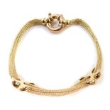 A 9ct gold bracelet, of multi-link design, with cross design bordering (AF), with large circular loo