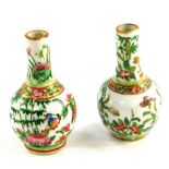 A pair of Qing Dynasty Cantonese famille rose porcelain miniature vases, painted with butterflies an