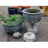 A near matching pair of classical designed planters, each of circular form raised with scrolls and f