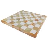 A green onyx and white marble chess board, 30cm wide.