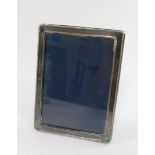 A silver framed strut photograph frame, Sheffield 1997, aperture 12.5cm high, 9cm wide, frame 15cm h