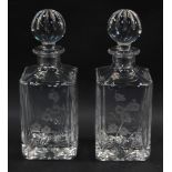 A pair of Royal Doulton cut glass decanters and stoppers, of square form, engraved with flowers, 26c