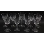 A set of nine Waterford crystal goblets decorated in the Lismore pattern.