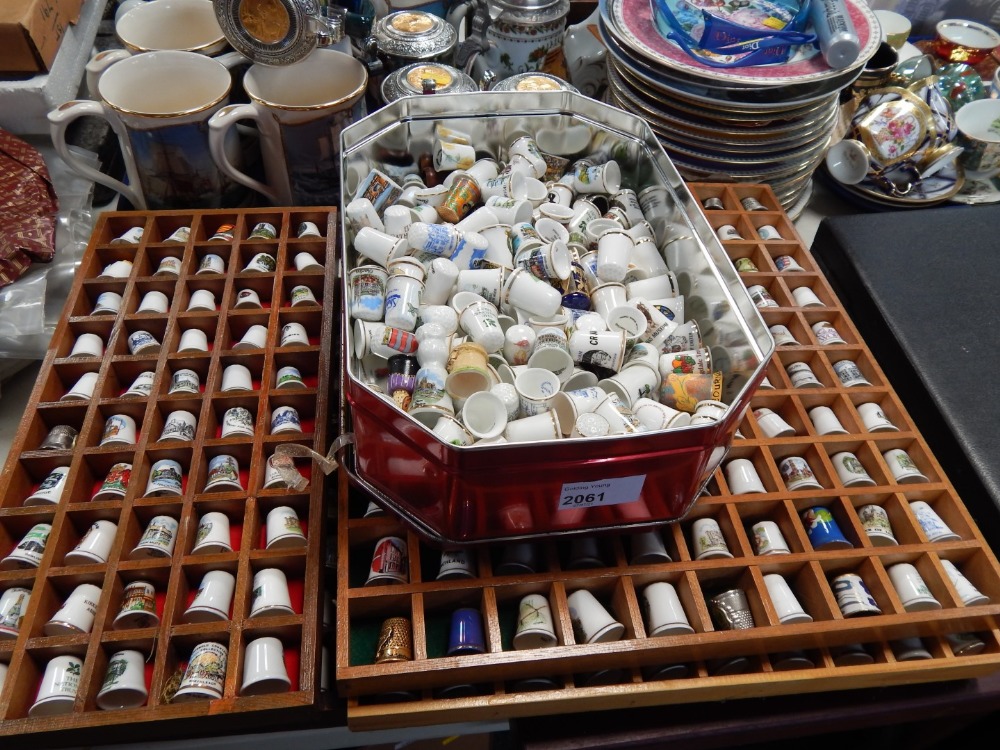 A large collection of decorative thimbles, collectors spoons, thimble, shells, etc. (a quantity)