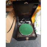 A 20thC table top record player, of small proportion, baize lined turntable.