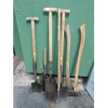 Various tools, including a Elwell hatchet, two log splitting axes, shepherd's crook and three spades