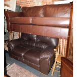 A brown leather three seater sofa, 221cm wide., together with a darker brown leather two seater sofa