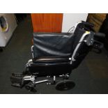 A Care Co folding wheelchair.