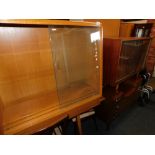 A glazed oak bookcase, teak bookcase and oak veneer dressing table with mirror. (3)