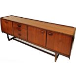 A retro teak sideboard, with twin cupboard doors single cupboard door and three drawers on shaped su