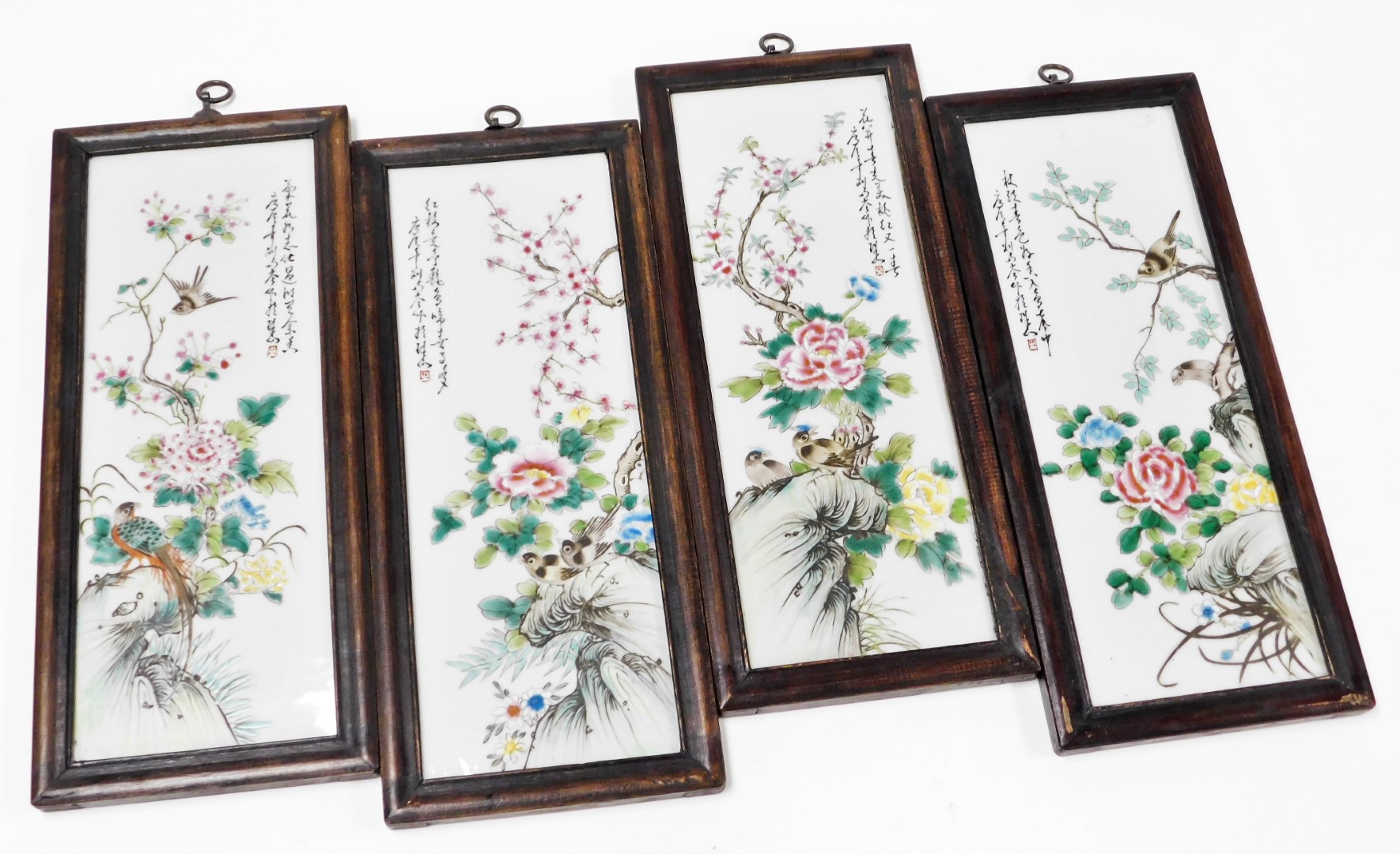 A set of four late 19thC Chinese porcelain panels, each decorated with birds and flowers, in stained