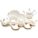 A Royal Albert Val D'or pattern part tea service, comprising teapot, six cups and saucers, six side