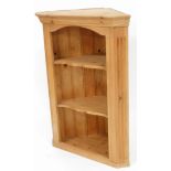 A pine hanging corner shelf, with moulded cornice above three shelves, 100cm high, 66cm wide, 41cm d