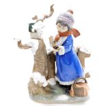 A large Lladro figure group, of a winter scene with young girl looking after birds, no. 5287, 28cm h