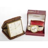 A Smith's crocodile skin cased travel clock, and a Rotary gentlemans wristwatch, boxed. (2)