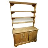 A Victorian pine kitchen dresser, with applied three shelf plate rack, on sideboard base with two cu