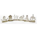 A set of six Eastern inspired name place holders, in silver coloured metal, stamped with a crown and