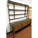 A late 18th/early 19thC oak dresser, the dresser back rack on sideboard with three drawers, with bra