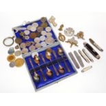 A set of six George VI silver teaspoons, cased, Sheffield 1945, various coins, military badges, etc.