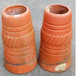 A pair of terracotta rhubarb houses, each of domed design with reeded and flared border, 60cm high.