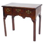 A George III mahogany lowboy, the rectangular top with a moulded edge, above three frieze drawers an