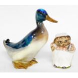 A Beatrix Potter Mrs Tiggy-Winkle figure, and a Royal Doulton mallard duck. (2, AF)