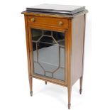 An Edwardian mahogany display cabinet, the canted top with single drawer above astragal glazed door,