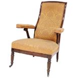 A Regency rosewood library open armchair, in the manner of Jas. Shoolbred & Co., with high scrolling