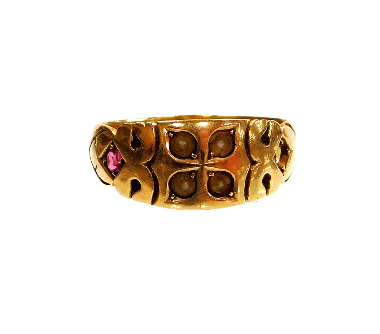An Edwardian dress ring, set with seed pearls and garnet (1 stone missing) yellow metal stamped 15c,