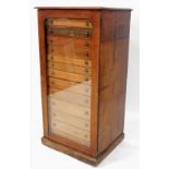 A Victorian collectors chest, with single glazed door, revealing a selection of thirteen numbered dr