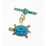 A turquoise and garnet set turtle brooch, with later bar pin and safety chain, in white metal stampe