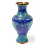 A Chinese cloisonné baluster vase, decorated with dragons chasing the flaming pearl, on a dark blue