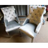 Two silvered dining room chairs, each with button backs on mirrored glass legs, 104cm high, 50cm