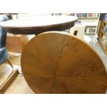 Two tables, comprising an oak circular side table, the round top on a later applied faux wood