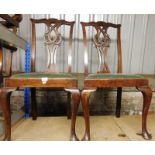 A pair of early 20thC Chippendale style mahogany dining chairs, each with green upholstered seat and