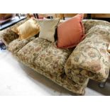 An early 20thC three seater Chesterfield sofa, with floral cream upholstery, 72cm high,