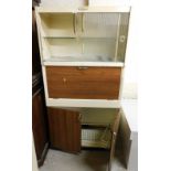 An Eastham retro larder cabinet, with sliding top above two cupboards, 175cm high, 90cm wide, 40cm