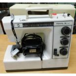 A Toyota 9980 electric sewing machine, with pedal.