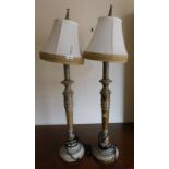 A pair of modern table lamps, in a cream coloured finish with associated shades, 89cm high. (AF)