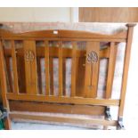 A late Victorian Art Nouveau oak double bedstead, with bed head, foot board and two metal