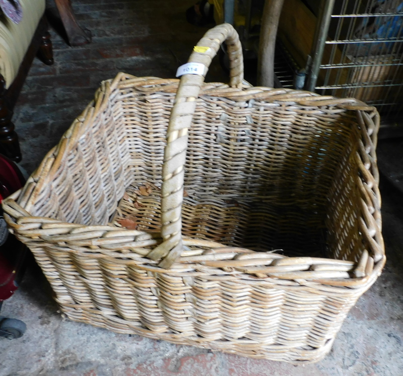 A rectangular wicket basket, with carrying handle.