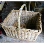 A rectangular wicket basket, with carrying handle.