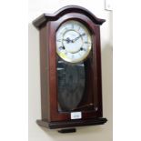 A Highlands mahogany cased wall clock.