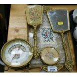 A dressing table set, floral design, dressing table tray, hand mirror, brush, mantel clock and pin