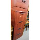 Two filing cabinets, comprising a stained red four draw filing cabinet, 134cm high, 48cm wide,