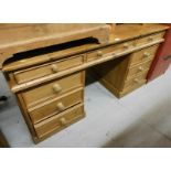 A pine twin pedestal desk, the top with three drawers above three drawer pedestals, 76cm high, 149cm