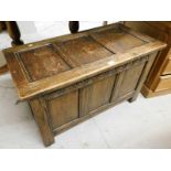 A carved oak coffer, with two panelled top above carved fan frieze, 54cm high, 92cm wide, 45cm