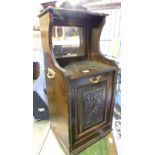 A Victorian mahogany coal purdonium, the top with rectangular mirror plate with carved cornice above